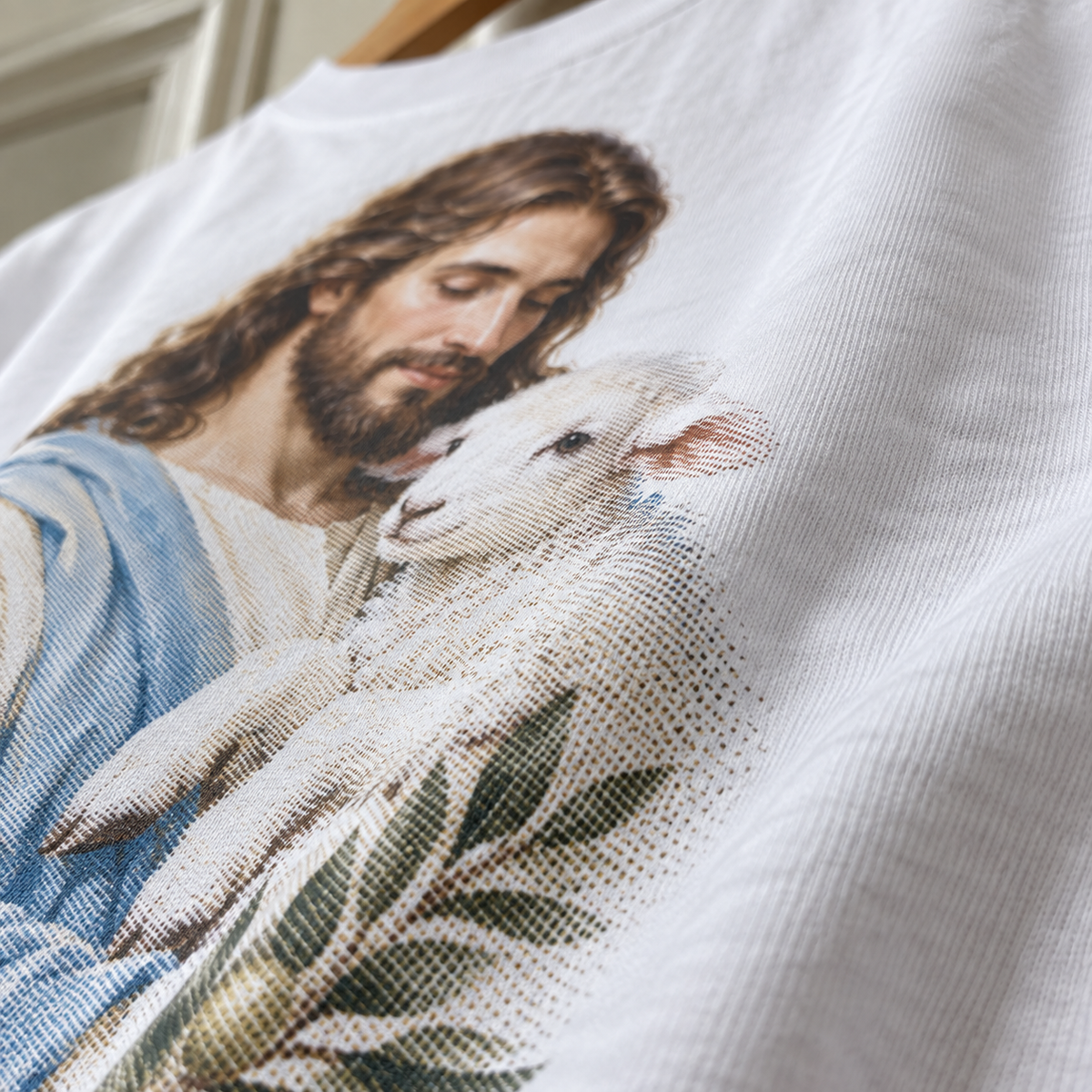 Textura da camiseta branca com a estampa Jesus, Bom Pastor